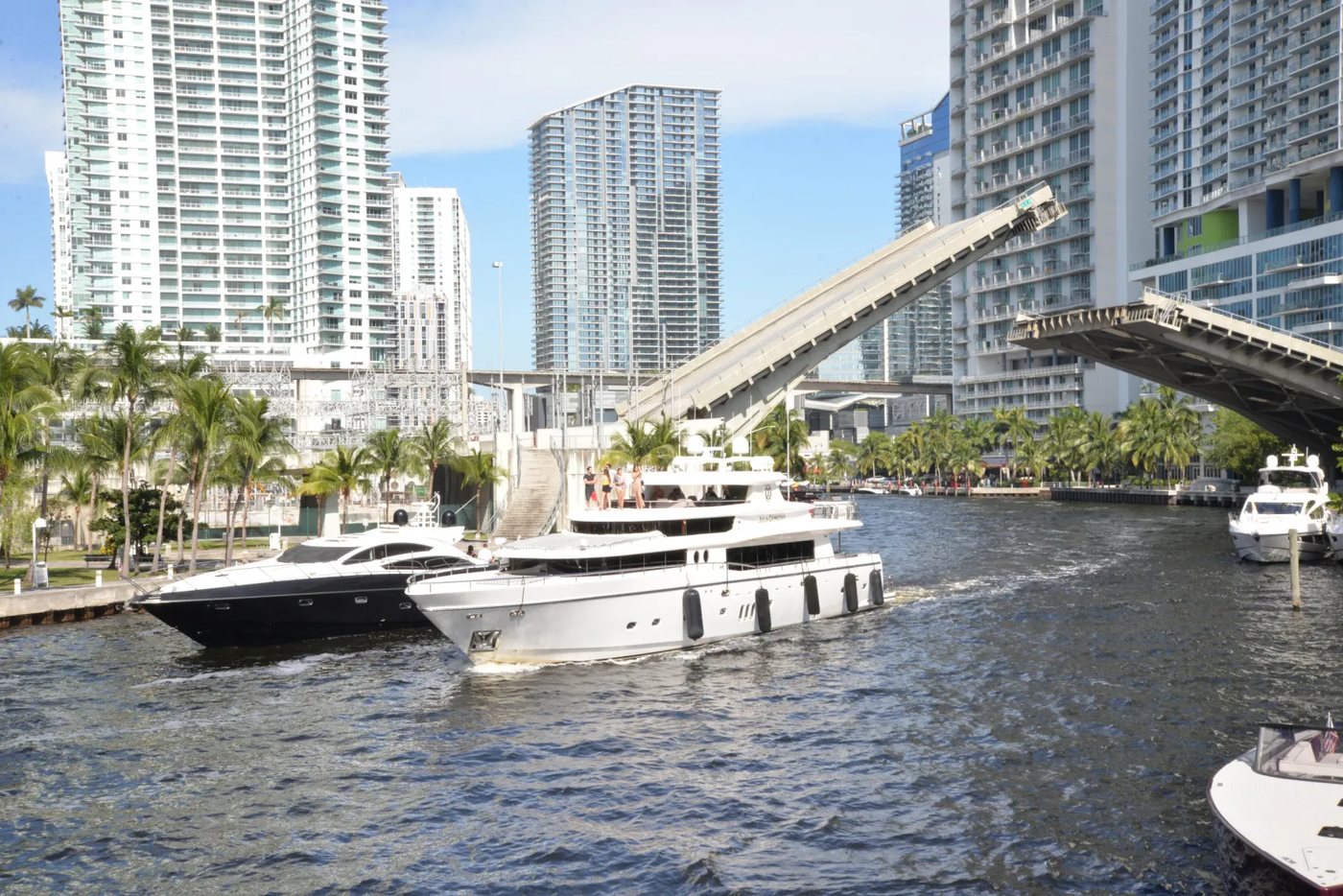 Drawbridge open on the Miami River as a yacht passes through beneath the Brickell towers