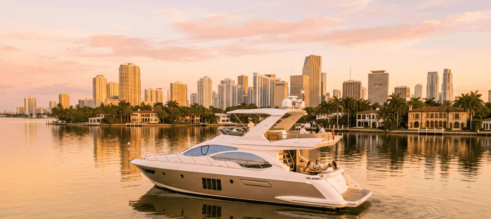 Azimut yacht charter at sunset with the Downtown Miami and Brickell skyline behind