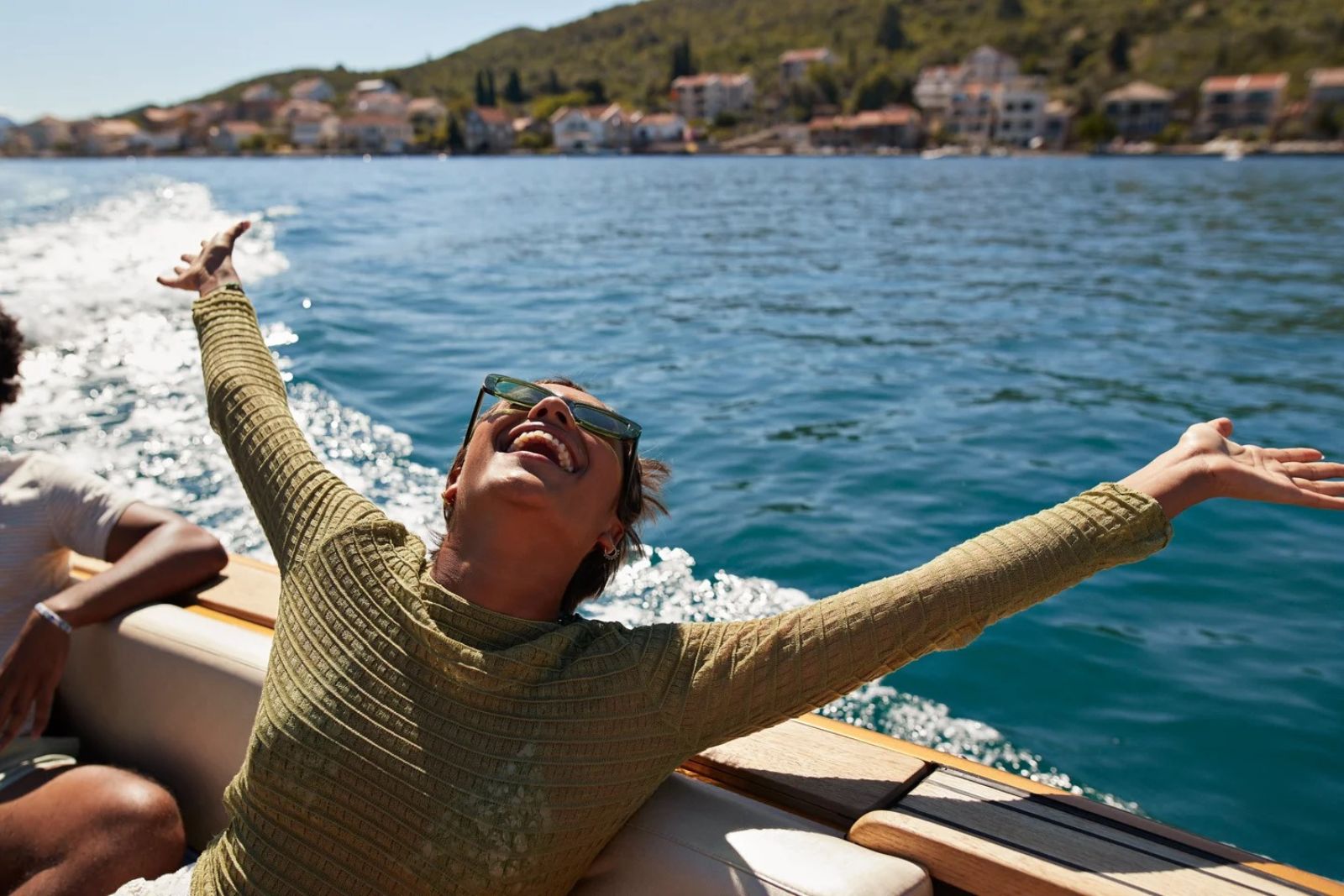 Fresh Start and Milestone Celebrations — joyful woman on yacht