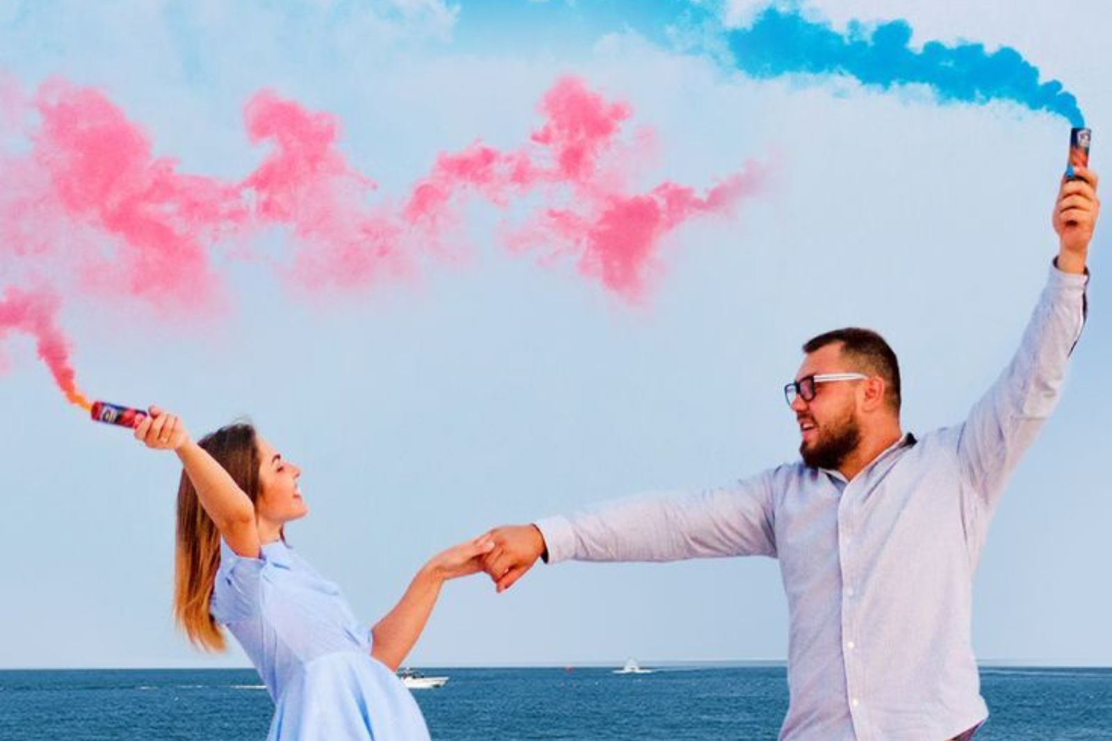 Gender Reveal — pink and blue smoke at sea