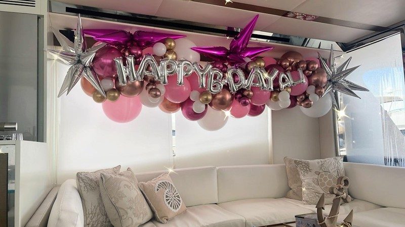 Happy birthday balloon garland in a yacht salon in Miami