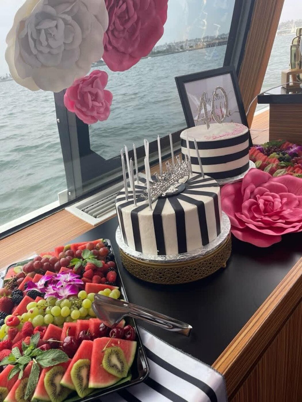 Birthday cakes and a fruit platter on board a yacht in Miami
