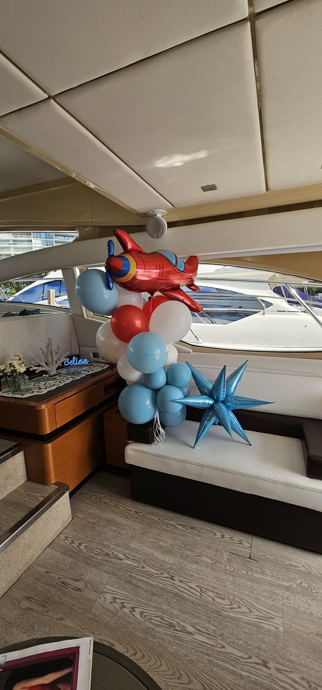 Children’s birthday balloon decorations inside a yacht salon in Miami