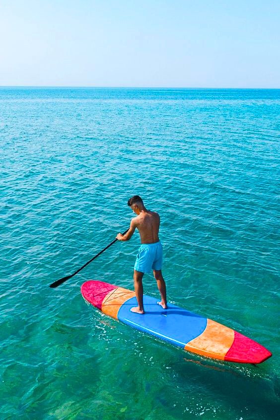 Paddleboarding off a yacht at a Miami sandbar