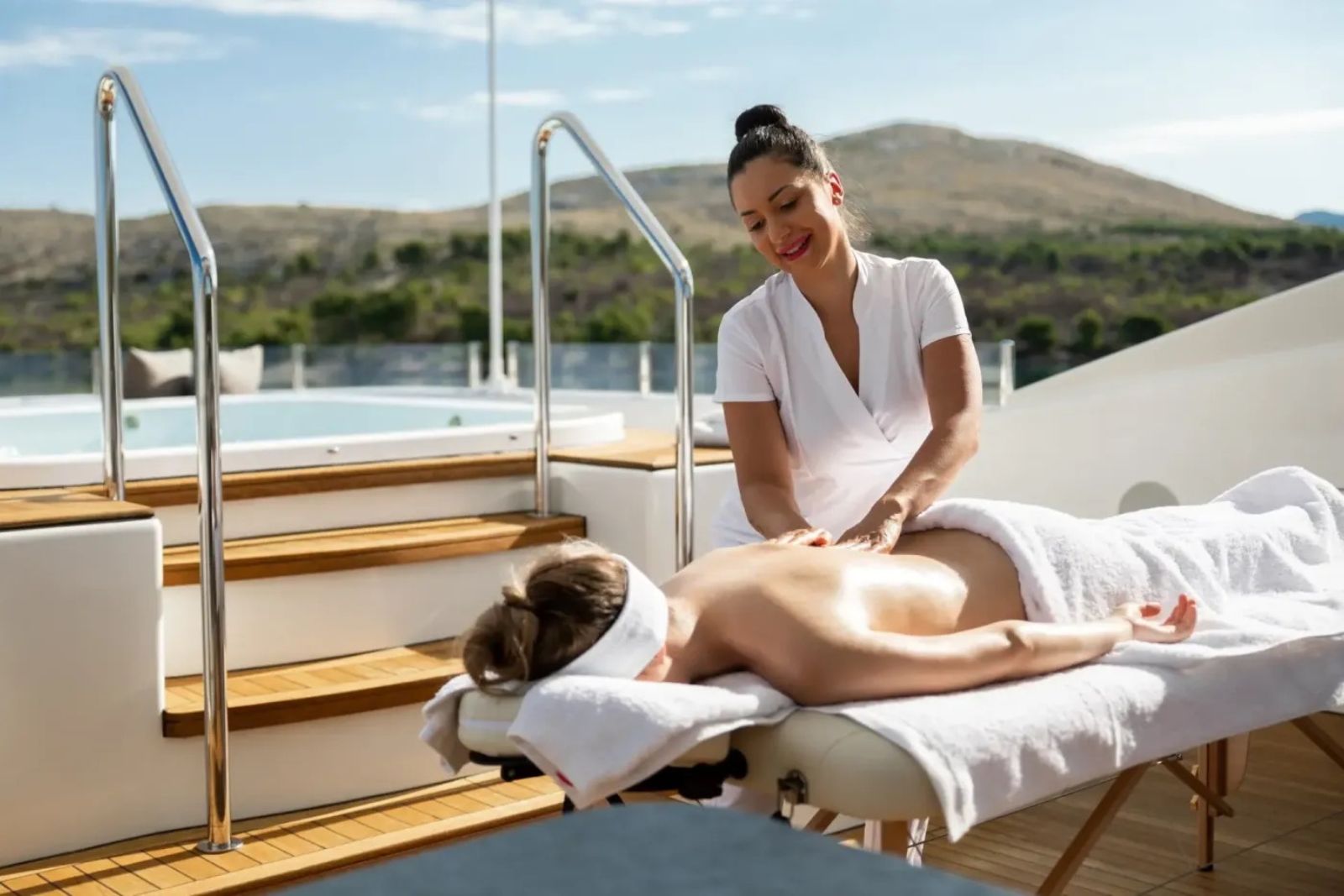 Onboard Massage Therapist — yacht deck massage with jacuzzi