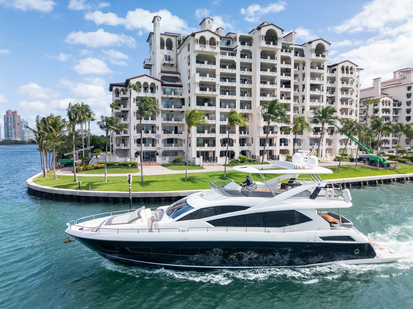 Yacht cruising past Fisher Island on a South Beach charter in Miami